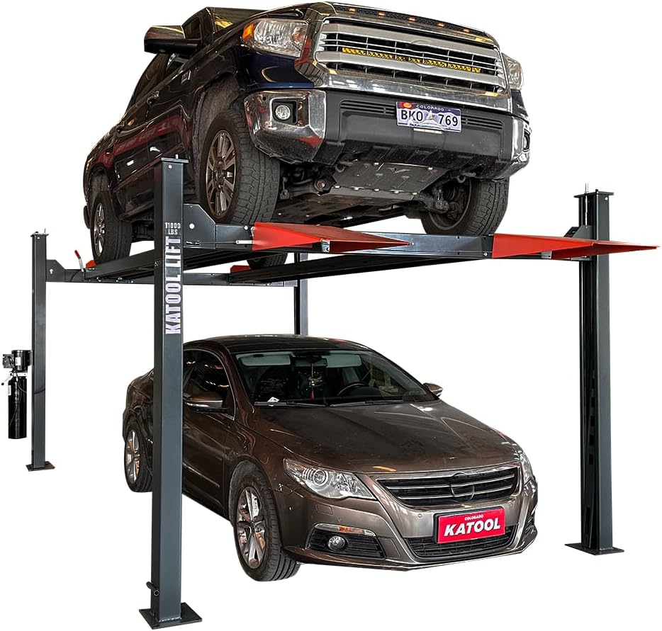 Katool KT-4H110 11,000 lb heavy-duty 4-post car lift holding a pickup truck above a sedan, with branded Katool posts and integrated sliding jack tray